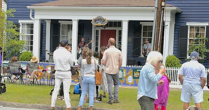 Crowd gathers at a porch performance at Columbus Porchfest 2026