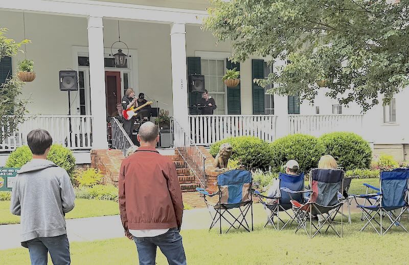 A band performs on a historic porch at Columbus Porchfest 2026